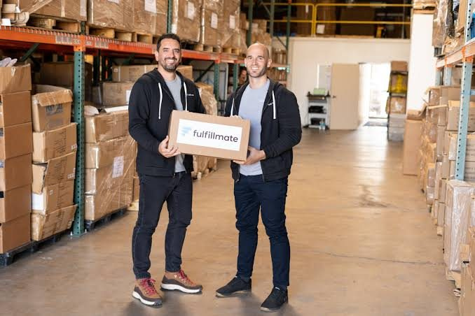 Ben Carman and his co-founder in one of the Fulfillmate US warehouses